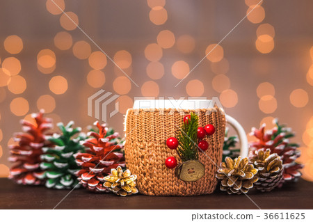 White mug in brown elegant festive knitted holder 36611625