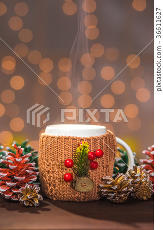 Closeup of white steaming winter cup Closeup of white steaming winter cup 36611627