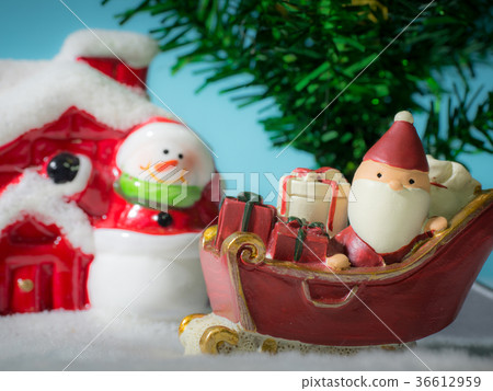 Happy Santa Claus with gifts box on the snow sled Happy Santa Claus with gifts box on the snow sled 36612959
