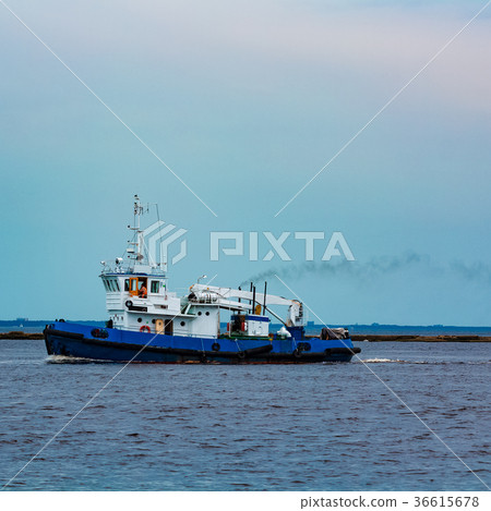 Blue tug ship underway Blue tug ship underway 36615678