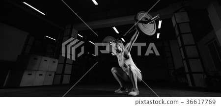 Female fitness athlete exercising Female fitness athlete exercising 36617769