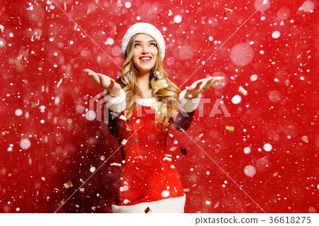 happy young woman dressed as santa with snow happy young woman dressed as santa with snow 36618275
