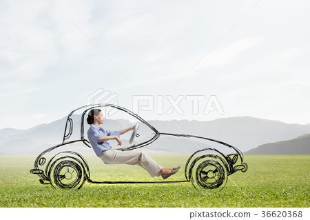 Woman in drawn car Woman in drawn car 36620368