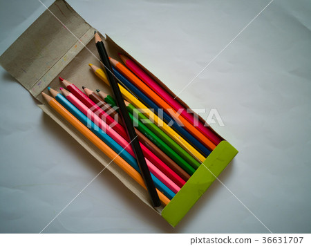 Old used and broken colour crayons on old paper 36631707