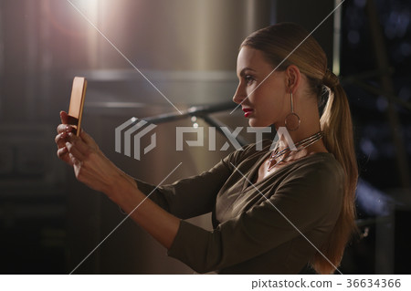 Pretty fashion model making selfie  36634366