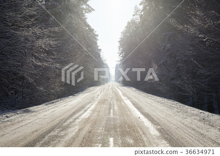 snow-covered road snow-covered road 36634971