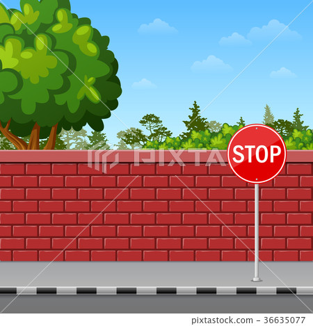 Brick wall with stop sign on the pavement Brick wall with stop sign on the pavement 36635077