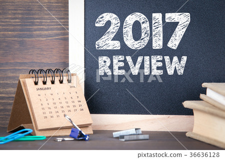 2017 review. paper calendar and chalkboard on a wooden table 2017 review. paper calendar and chalkboard on a wooden table 36636128