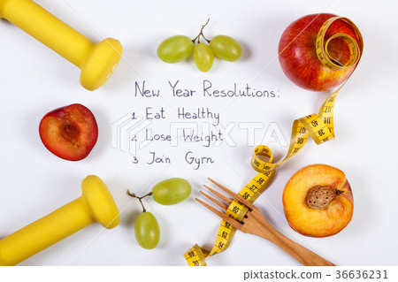 New year resolutions, fruits, dumbbells centimeter New year resolutions, fruits, dumbbells centimeter 36636231