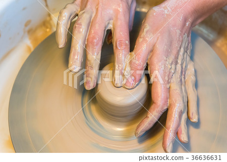 womens hands of a potter creating an earthen jar 36636631