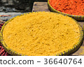 Turmeric powder on the trays in the market 36640764