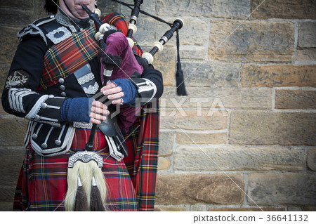 Playing the bagpipes on streets of Edinburgh 36641132