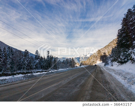 Winter mountain landscape with road and snow Winter mountain landscape with road and snow 36643157