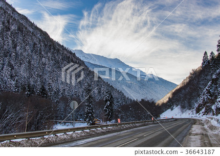 Winter mountain landscape with road and snow Winter mountain landscape with road and snow 36643187