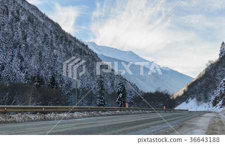 Winter mountain landscape with road and snow Winter mountain landscape with road and snow 36643188