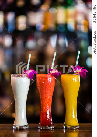 still life with 3 cocktails and orchid flowers 36643466