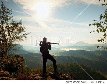 Nature photographer stay at tripod on summit 36643947