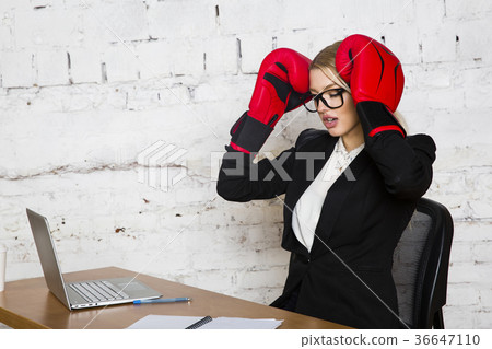 Young blond beauty businesswoman sitting at a 36647110