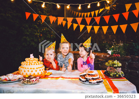 Children's birthday party. Three cheerful children 36650323