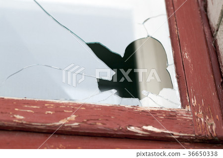 Broken glass, close-up window 36650338