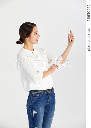 Twenties woman enjoying cell phone Twenties woman enjoying cell phone 36650932
