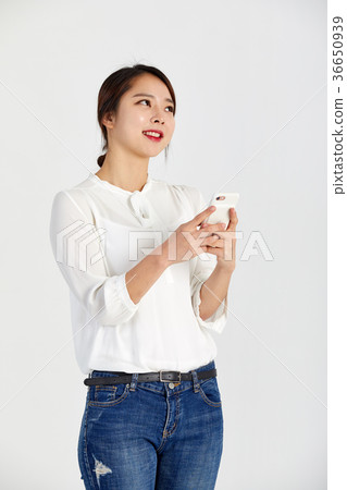 Twenties woman enjoying cell phone Twenties woman enjoying cell phone 36650939