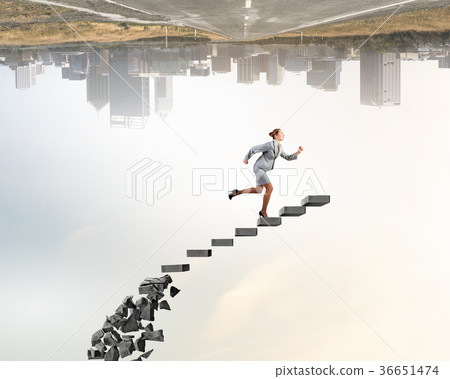 Businesswoman climbing stone ladder Businesswoman climbing stone ladder 36651474