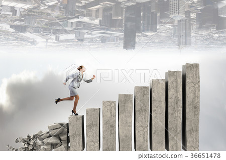 Businesswoman climbing stone ladder Businesswoman climbing stone ladder 36651478