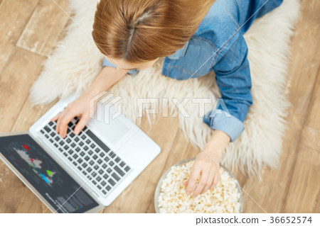 Blond young woman working from home Blond young woman working from home 36652574