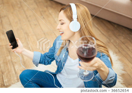 Alert woman drinking and singing on the floor 36652654