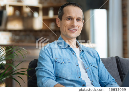 Positive freelancer looking straight at camera 36653069