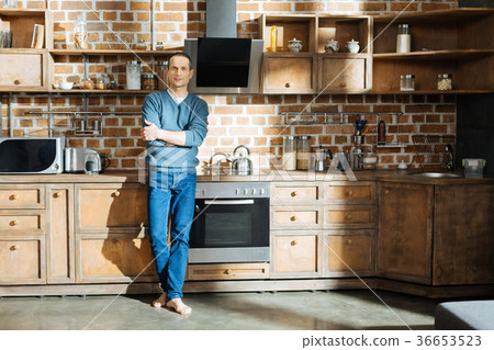 Confident man standing in the kitchen 36653523