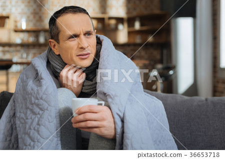 Attractive young man having flue Attractive young man having flue 36653718