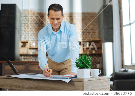 Competent manager counting his income products Competent manager counting his income products 36653770