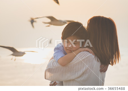 Asian mother hugging her son Asian mother hugging her son 36655488