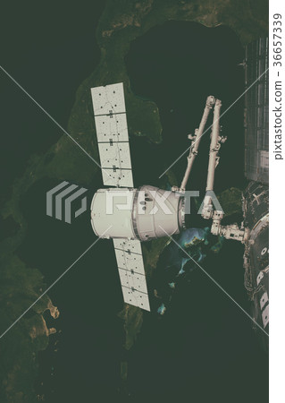 SpaceX Dragon orbiting the planet Earth. SpaceX Dragon orbiting the planet Earth. 36657339