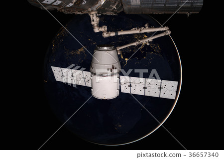 SpaceX Dragon orbiting the planet Earth. SpaceX Dragon orbiting the planet Earth. 36657340