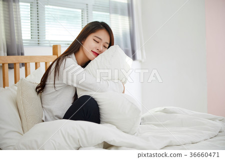 Twenties resting in bed 36660471