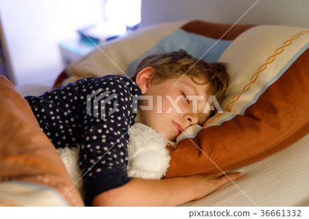 Little preschool kid boy sleeping in bed with Little preschool kid boy sleeping in bed with 36661332