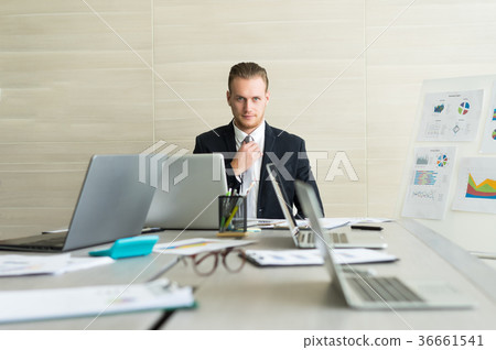 Handsome businessman in dark blue suit necktie Handsome businessman in dark blue suit necktie 36661541