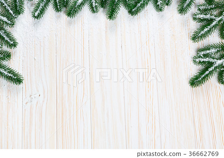 Christmas fir tree with snow on white wooden Christmas fir tree with snow on white wooden 36662769