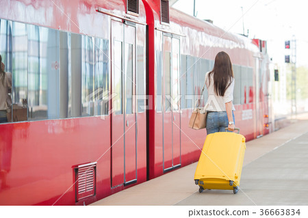Back view of woman with bag at station traveling 36663834