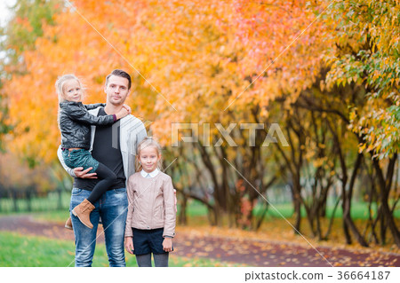 Family of dad and kids on beautiful autumn day in Family of dad and kids on beautiful autumn day in 36664187