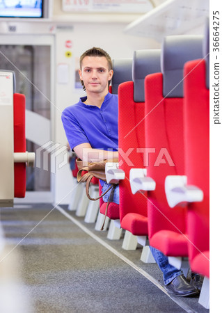 Young man traveling by train 36664275