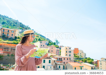 Young woman with map at old village in Liguria Young woman with map at old village in Liguria 36664653