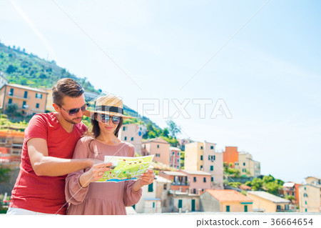 Young family with map bacground the great view at Young family with map bacground the great view at 36664654