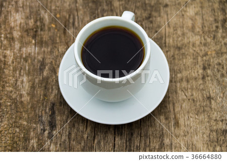 Cup of coffee on wooden table Cup of coffee on wooden table 36664880