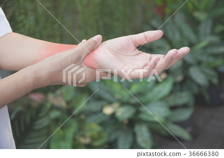 Man holding his wrist. Pain in a man wrist. 36666380