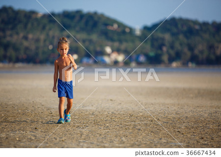 Little boy on the beach 36667434