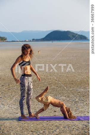 Mother with her son doing yoga Mother with her son doing yoga 36667999